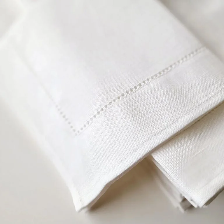 Custom cotton napkins with color swatches and linen bag packaging