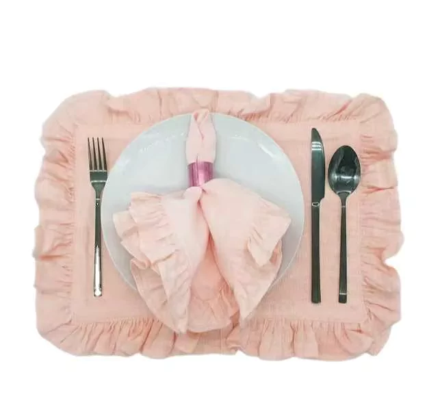 Ruffled cotton napkin set in off-white styled on a garden wedding table